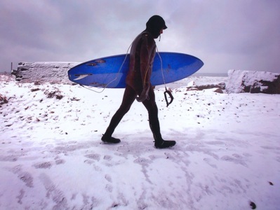 Julien surfing in the winter.  Passionate - or crazy?